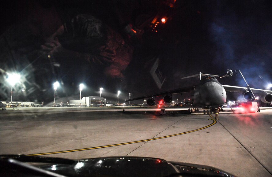 U.S Air Force Reserve Airmen assigned to the 452nd Aircraft Maintenance Squadron and 446th Maintenance Squadron spray propylene glycol onto a C-5 Galaxy aircraft at Ramstein Air Base, Germany, Jan. 19, 2017. The purpose of the spray was to deice the aircraft before it took off by absorbing water. Airmen from multiple Reserve aircraft maintenance squadrons are on a temporary duty assignment at Ramstein to train with the 721st AMXS. (U.S. Air Force photo by Senior Airman Tryphena Mayhugh)