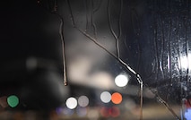 Propylene glycol, a liquid used to deice aircraft, drips down the windshield of a truck after deicing a C-5 Galaxy aircraft at Ramstein Air Base, Germany, Jan. 19, 2017. Airmen from multiple U.S. Air Force Reserve aircraft maintenance squadrons are on a temporary duty assignment at Ramstein to train with the 721st AMXS. (U.S. Air Force photo by Senior Airman Tryphena Mayhugh)