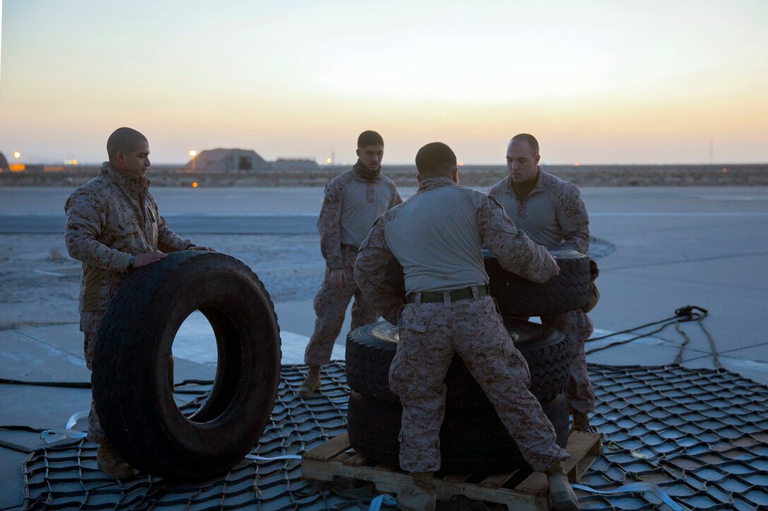 U.S. Marines with Combat Logistics Battalion 7, Special Purpose Marine Air-Ground Task Force-Crisis Response-Central Command, prepare a heavy equipment training load for a helicopter support team (HST) training exercise with Marine Medium Tiltrotor Squadron 165 while forward deployed in the Middle East, Jan. 13, 2017. An HST assists with attaching large cargo to an aircraft in order to transport it quickly to other locations. The ability to move cargo or heavy equipment almost anywhere enhances the crisis response capabilities of the SPMAGTF. 