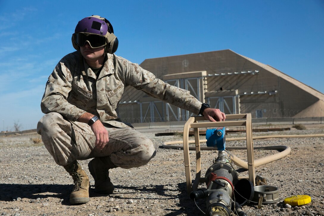 Lance Cpl. Tyler Tomko, a bulk fuel specialist with Marine Wing Support Squadron 371, Special Purpose Marine Air-Ground Task Force-Crisis Response-Central Command, monitors a fuel line while extracting fuel from an MV-22 Osprey during a training exercise while forward deployed in the Middle East, Jan. 6, 2017. Marines with MWSS-371 are testing their helicopter expedient refueling system; this allows for quick refueling in austere environments. Being able to refuel almost anywhere contributes to the Special Purpose Marine Air-Ground Task Force’s crisis response capabilities. 