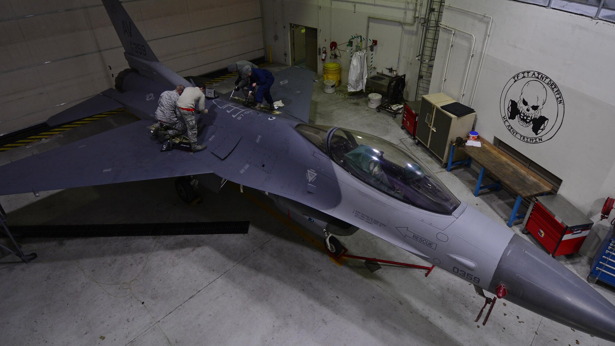 Airmen from the 31st Maintenance Squadron Aircraft Fuel Systems flight removed panels on an F-16 Fighting Falcon at Aviano Air Base, Italy on Jan. 18, 2017. The F-16 phase inspection included fuel tank and line checks to ensure they met safety standards. (U.S. Air Force photo by Senior Airman Cary Smith)