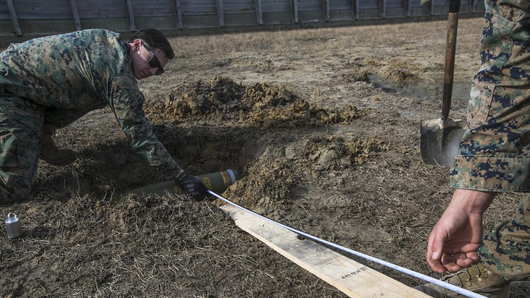 Marines measure standoff distance while conducting a low-order demolition range at Camp Lejeune, N.C., Jan. 17th, 2017. The range was conducted to enable the Marines to be more capable of detonating unexploded ordnance without releasing shrapnel. The Marines are explosive ordnance technicians with 2nd Explosive Ordnance Disposal Company S.