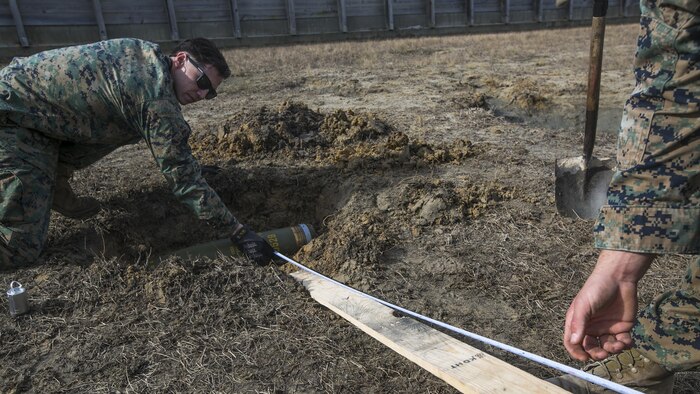 Marines measure standoff distance while conducting a low-order demolition range at Camp Lejeune, N.C., Jan. 17th, 2017. The range was conducted to enable the Marines to be more capable of detonating unexploded ordnance without releasing shrapnel. The Marines are explosive ordnance technicians with 2nd Explosive Ordnance Disposal Company S.