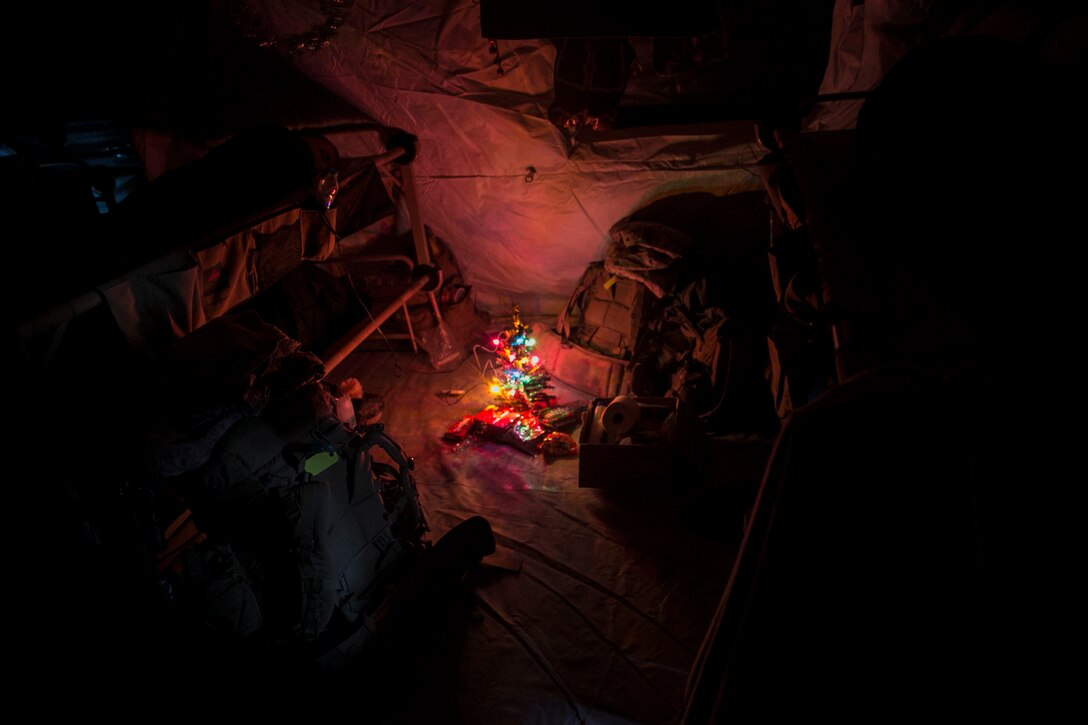 Marines with 3rd Battalion, 7th Marine Regiment, Special Purpose Marine Air-Ground Task Force -Crisis Response-Central Command, sleep near a Christmas tree while forward deployed in Northern Iraq, Dec. 23, 2016. SPMAGTF Marines enable Combined Joint Task Force Operation-Operation Inherent Resolve with security forces, strikes, and advise and assist teams, all of which support the Iraqis in their efforts to defeat ISIL.