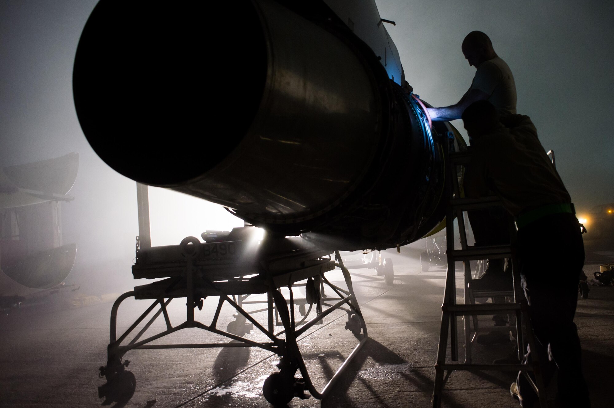 A 380th Expeditionary Aircraft Maintenance Squadron crew repairs an E-3 Sentry (AWACS) engine at an undisclosed location in Southwest Asia, Jan. 12, 2017. (U.S. Air Force photo/Senior Airman Tyler Woodward)