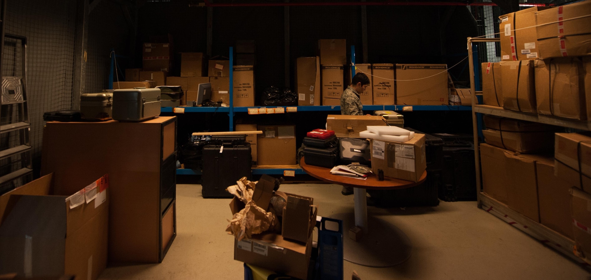 Senior Airman Gregory Solano II, 86th Operations Support Group aircrew flight equipment technician, works inside what his unit calls “the cage,” a room where stock is kept on high-rising shelves, at Ramstein Air Base, Germany, Jan. 19, 2017. The AFE flight mission is to ensure the safety of aircrew by properly equipping them for everyday and emergency missions. Most equipment is kept ready for use at any time in this room. (U.S. Air Force photo by Airman 1st Class Lane T. Plummer)