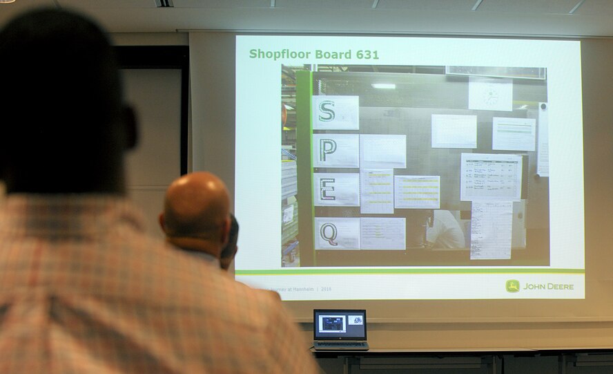 Attendees of a Continuous Process Improvement Senior Leader Course view a board used to monitor progress and change suggestions at a John Deere factory in Mannheim, Germany, Jan. 10, 2017. The students of the course traveled to Mannheim from Ramstein Air Base to see firsthand how a company implements some of the tools they learned in the course. (U.S. Air Force photo by Staff Sgt. Timothy Moore)