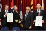 NSWC IHEODTD officially announced its partnership with Nammo Energetics Indian Head (NEIH), under the command's Center for Industrial and Technical Excellence (CITE) designation, Jan. 19. CITE is a statutory authority allowing public-private partnerships to perform work related to the command's core competencies. This designation allows the Navy to more efficiently maintain an organic energetics capability and manage under-utilized capacity. (Pictured left to right) President and CEO Nammo Group/Nammo AS, Morten Brandtzaeg; NSWC IHEODTD Commanding Officer, Capt. Scott Kraft; NEIH President, Peter Sioma; NSWC IHEODTD Technical Director, Ashley Johnson. 