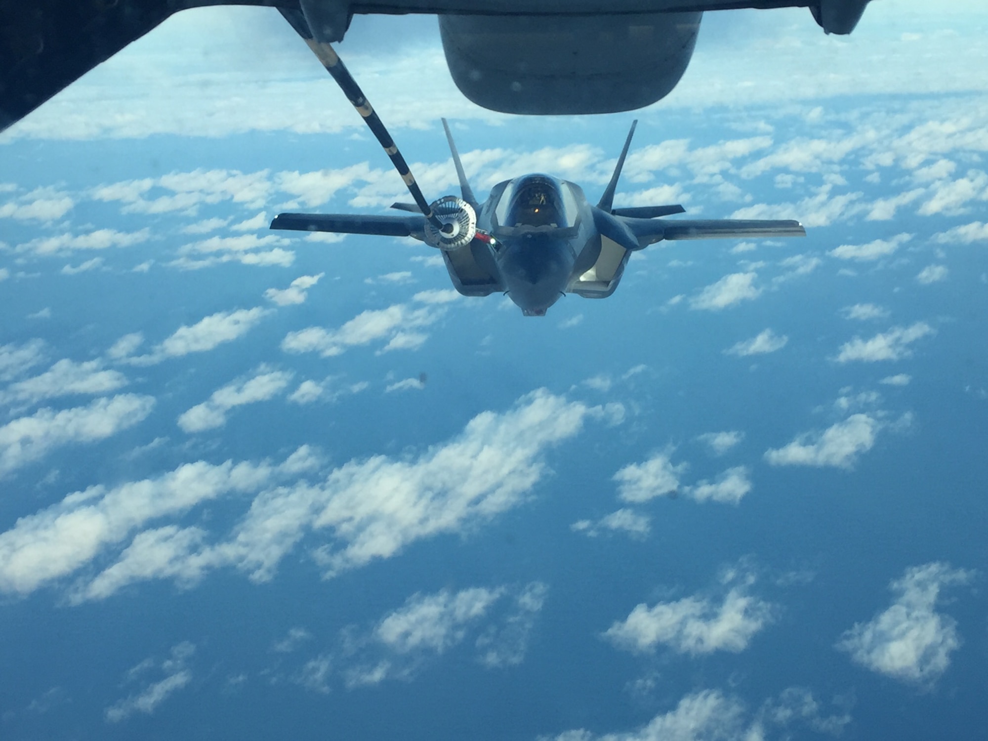 A F-35B Lightning II aircraft, from Marine Fighter Attack Squadron 121 (VMFA-121) receives fuel from a Travis Air Force Base, California, KC-10 Extender as the aircraft make the flight across the Pacific Ocean, Jan. 18, 2017. The transfer of VMFA -121 from MCAS Yuma, Arizona, to MCAS Iwakuni, Japan marks the first permanent international deployment of the joint strike fighter. (courtesy photo)