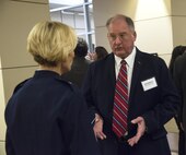 U.S. Air Force Brig. Gen. Heather Pringle, 502nd Air Base Wing and Joint Base San Antonio commander, speaks with retired U.S. Air Force Brig. Gen. Bob Murdock, a former Kelly Air Force Base commander, at the Kelly Field 100th Anniversary Celebration at Port San Antonio Headquarters in San Antonio. Murdock was the commander of Kelly Air Force Base, which housed Kelly Field, when it officially closed in August 2001. 