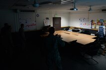 Expeditionary Active Shooter Training students practice barricading the door during an exercise Dec 15. on Ramstein Air Base, Germany. The EAST course teaches Airmen preparing to deploy how to handle an active shooter situation in a practical manner that can be used day-to-day. (U.S. Air Force photo by Airman 1st Class D. Blake Browning)