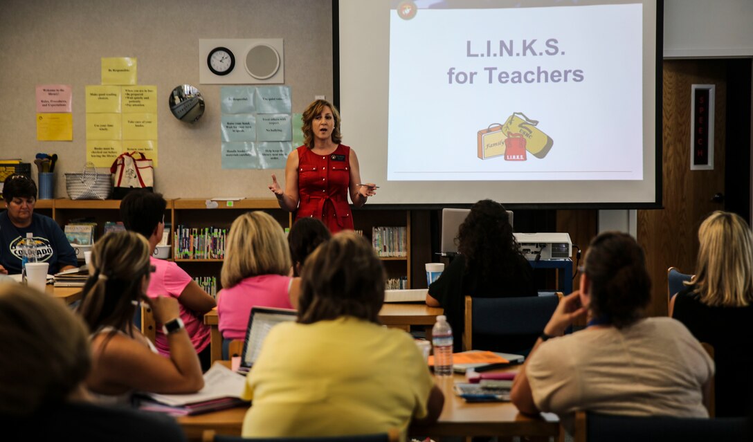 Elena McShane, the school liaison for Marine Corps Air Station Yuma, Ariz., introduces the outreach program, “L.I.N.K.S. (Lifestyles, Insights, Network, Knowledge & Skills) for Teachers,” that familiarizes teachers with the needs of military students at Palmcroft Elementary School Friday, August 4, 2016.