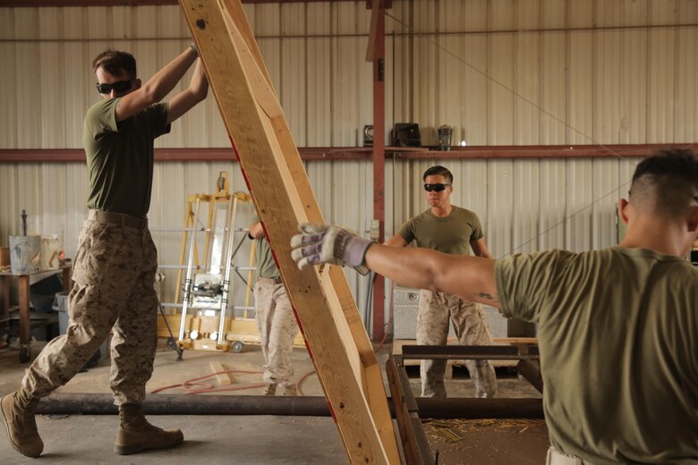 Marines assigned through the fleet assistance program with Headquarters and Headquarters Squadron, assist with range maintenance by pre-fabricating wooden targets to support tenant and visiting commands during Weapons and Tactics Instructors course 1-17 aboard Marine Corps Air Station Yuma, Ariz., September 29, 2016.
