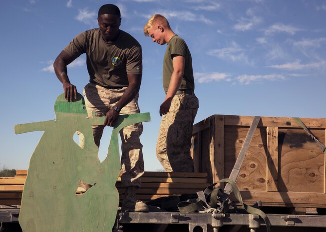 Marines assigned through the fleet assistance program with Headquarters and Headquarters Squadron, stationed at Marine Corps Air Station Yuma, Ariz., assist the range maintenance section by placing pre-assembled wooden targets in the Chocolate Mountain Aerial Gunnery Range to support Weapons and Tactics Instructors course 1-17 aboard MCAS Yuma, Ariz., Saturday, October 8, 2016.