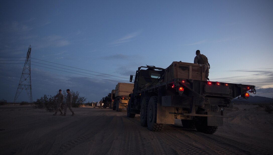 Marines assigned through the fleet assistance program with Headquarters and Headquarters Squadron, stationed at Marine Corps Air Station Yuma, Ariz., assist the range maintenance section by placing pre-assembled wooden targets in the Chocolate Mountain Aerial Gunnery Range to support Weapons and Tactics Instructors course 1-17 aboard MCAS Yuma, Ariz., Saturday, October 8, 2016.