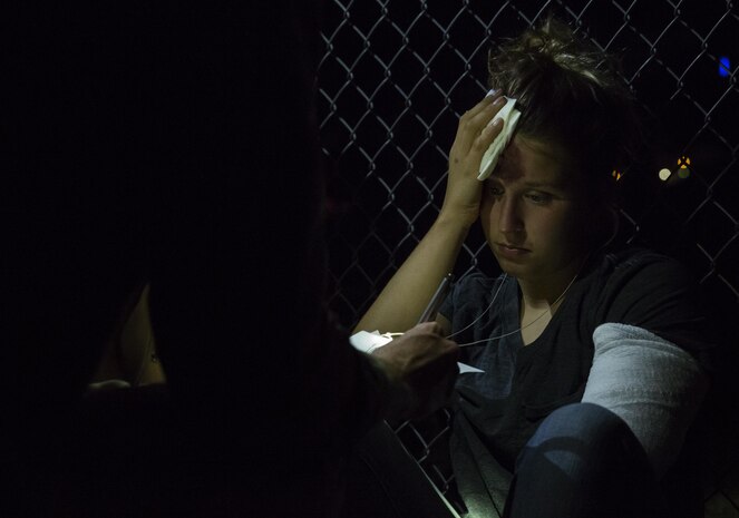 Sailors attached to the 2nd Battalion, 3rd Marine Regiment, based out of Marine Corps Base Hawaii, provide medical aid at Kiwanis Park in Yuma, Ariz., during a Humanitarian Assistance/Disaster Relief (HA/DR) Exercise hosted by Marine Aviation Weapons and Tactics Squadron One during the Weapons and Tactics Instructor Course 1-17, Friday, October 14, 2016. 