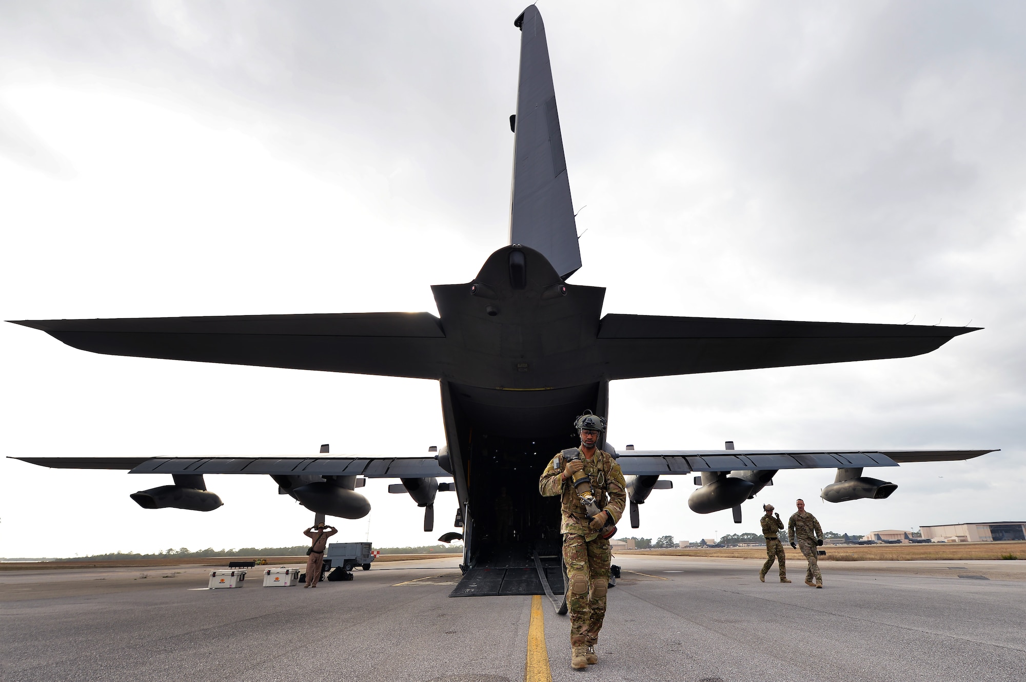 Staff Sgt. Michael Dunning, the manager for the forward area refueling point program with the 1st Special Operations Logistics Readiness Squadron, hauls a fuel hose from an MC-130H Combat Talon II aircraft as part of a class demonstration at Hurlburt Field, Fla., Jan. 10, 2017. The FARP program is a United States Special Operations Command initiative that trains petroleum, oils and lubrication Airmen to perform covert, nighttime refueling operations in deployed locations where fueling stations are not accessible or when air-to-air refueling is not possible. (U.S. Air Force photo by Senior Airman Andrea Posey)