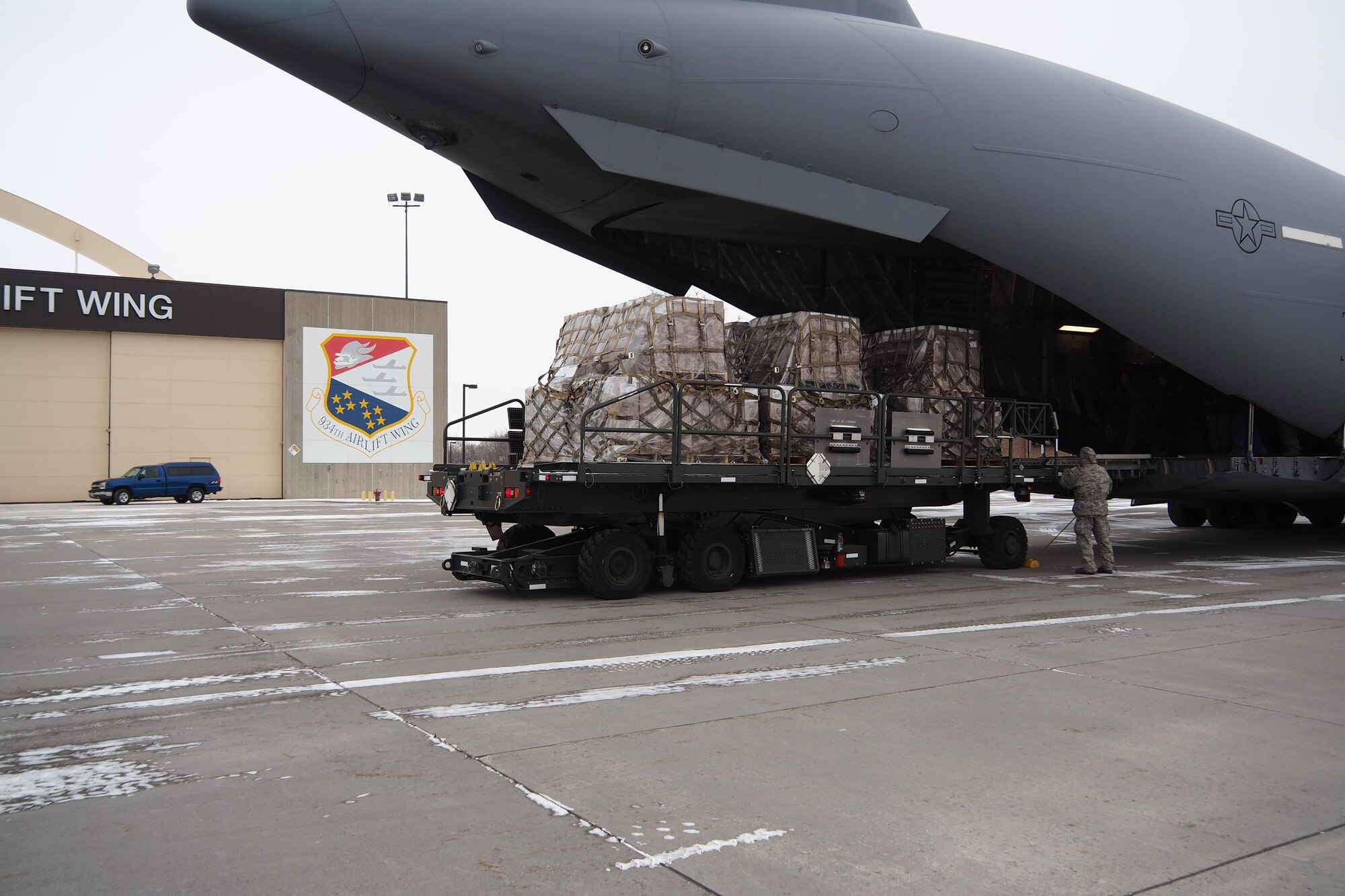 More than 50,000 pounds of humanitarian cargo is uploaded Jan. 13 at the 934th Airlift Wing by members of the 27th Aerial Port Squadron.  The cargo was headed for Northern Iraq as part of the Denton program.