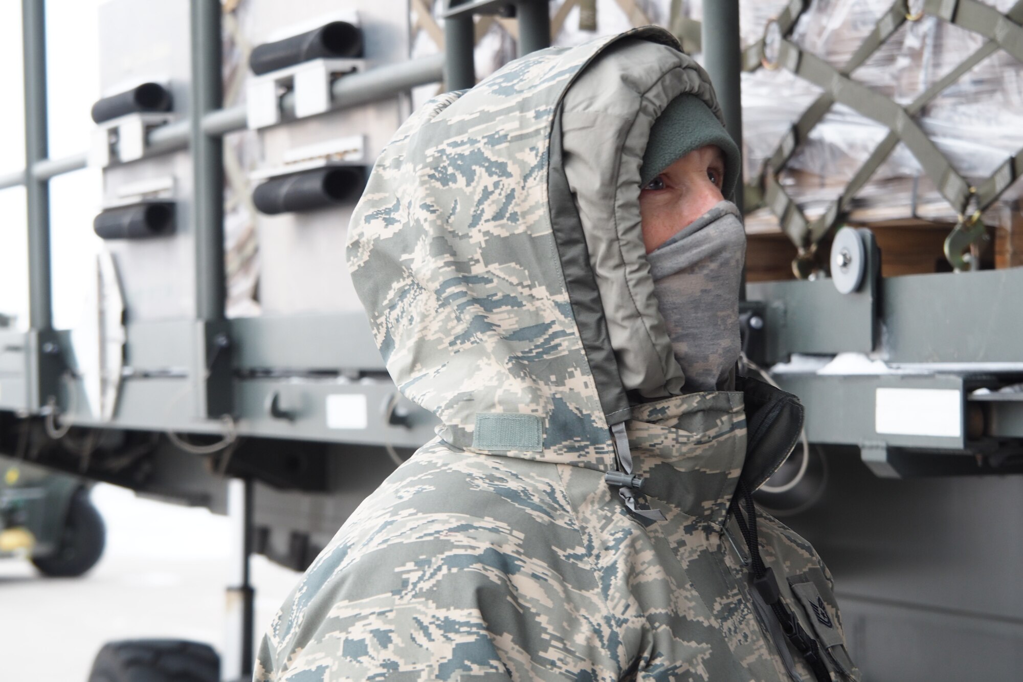 With temperatures near zero, more than 50,000 pounds of humanitarian cargo is uploaded Jan. 13 at the 934th Airlift Wing by members of the 27th Aerial Port Squadron.  The cargo was headed for Northern Iraq as part of the Denton program.