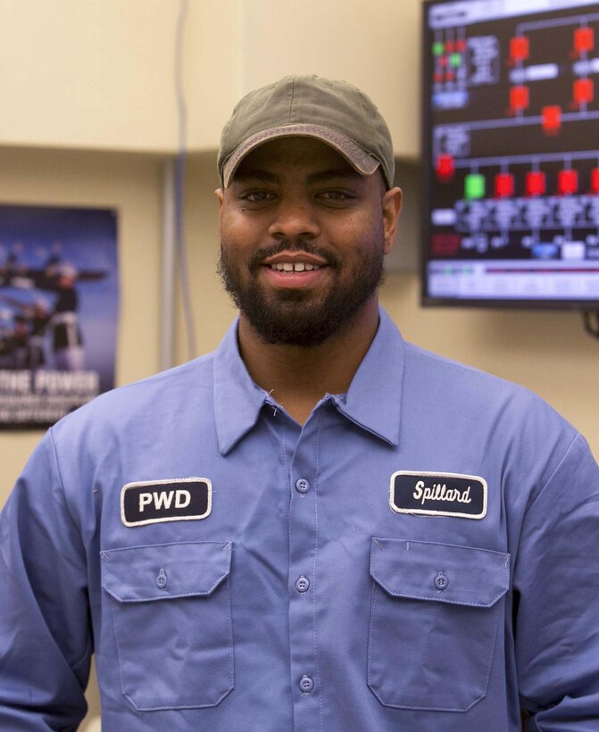 Mike Spillard, boiler plant operator, Public Works Division, enjoys building and assembling components and has plans to study engineering in Japan. Spillard, a former Marine intelligence specialist, is learning Japanese while he saves up to go to college. (Official Marine Corps photo by Cpl. Thomas Mudd/Released)