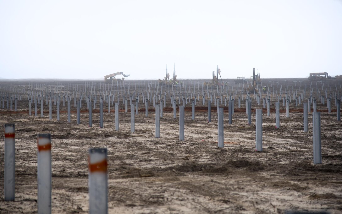 Amid heavy fog, construction continues on the 240-acre Solar Array located on Eglin Air Force Base, Fla.  The ceremonial first solar panel was installed Jan. 18 during a ceremony involving the three project partners, the Air Force, Gulf Power and Coronal Development Services.  (U.S. Air Force photo/Samuel King Jr.)