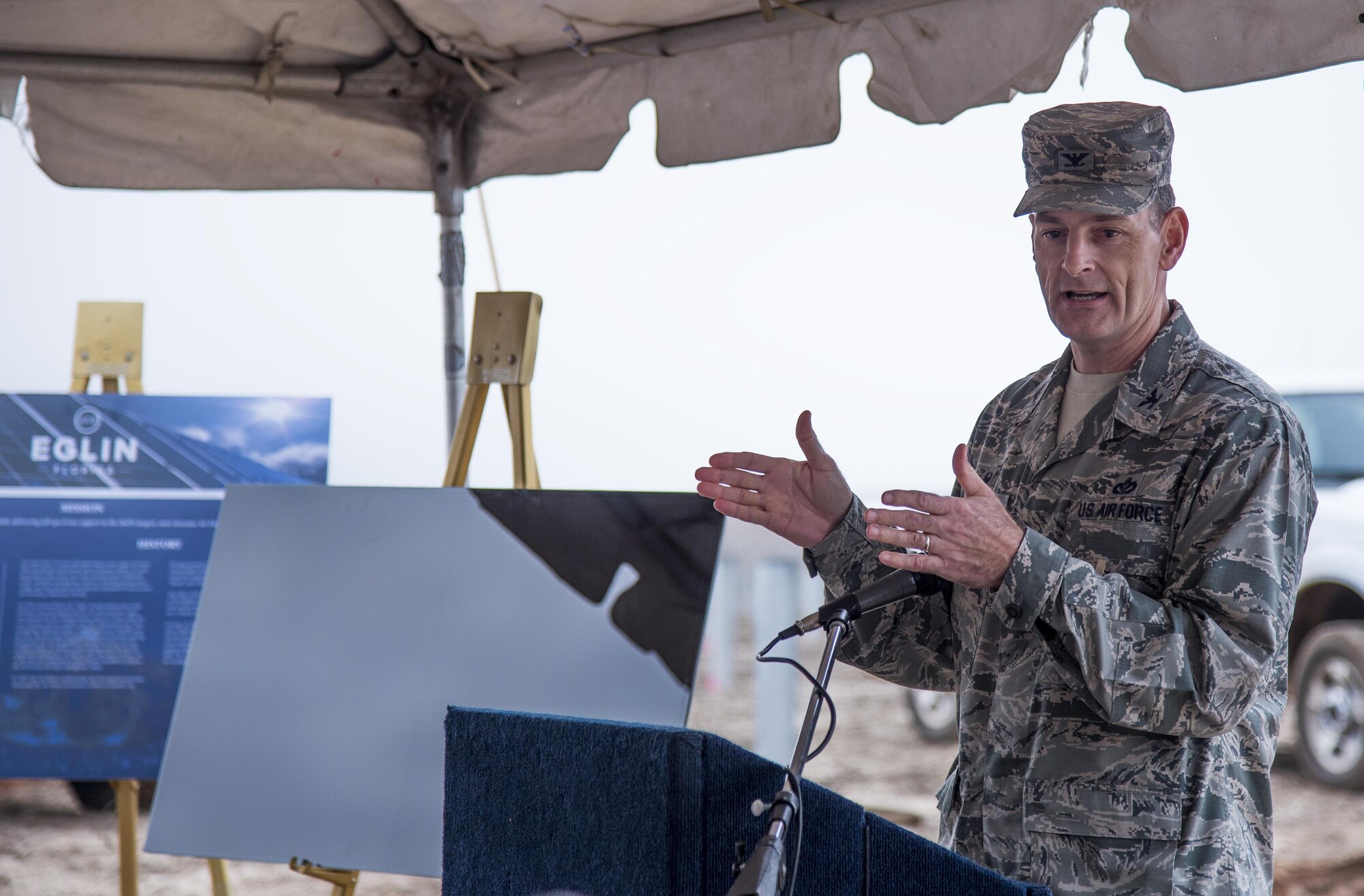 Col. Craig Johnson, 96th Civil Engineer Group commander, speaks to the crowd gathered for a small ‘first installation’ ceremony of the 240-acre solar array Jan. 18 at Eglin Air Force Base, Fla.  Leaders from the three project partners, Air Force, Gulf Power and Coronal Development Services, installed the first of the eventual 375,000 solar panels that will be located on the site.  (U.S. Air Force photo/Samuel King Jr.)