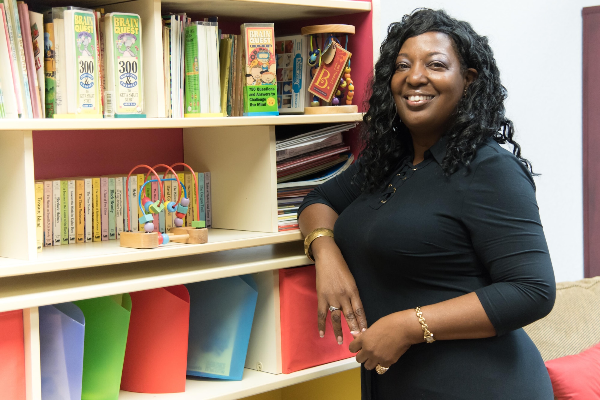 Anita Hymes, Keesler Air Force Base Family Child Care coordinator poses for a photo in the FCC office Jan. 19. The FCC program provides 403rd Wing Citizen Airmen with childcare options while they support the mission.(U.S. Air Force photo/Staff Sgt. Heather Heiney)