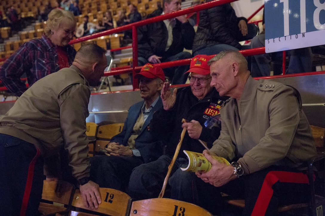 Sgt. Maj. Patrick L. Kimble (left), sergeant major of Marine Forces Reserve and Marine Forces North, and Lt. Gen. Rex C. McMillian (right), commander of MARFORRES and MARFORNORTH, talk with World War II veterans who fought in the Battle of Iwo Jima at the National Western Stock Show in Denver, Jan. 17, 2017. Leaders of MARFORRES were in attendance to commemorate veterans and the 100th anniversary of the Marine Corps Reserve. From World War I through the wars in Iraq and Afghanistan, the Marine Corps Reserve has played an essential role in the Marine Corps Total Force by augmenting and reinforcing the active component across the full range of military operations. (U.S. Marine Corps photo by Lance Cpl. Dallas Johnson/Released)