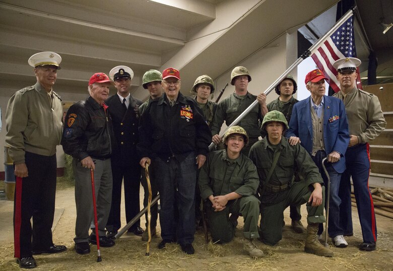 Lt. Gen, Rex C. McMillian (left), commander of Marine Forces Reserve and Marine Forces North, Master Chief Petty Officer Christopher D. Kotz (middle), command master chief of MARFORRES and MARFORNORTH, and Sgt. Maj. Patrick L. Kimble (right), sergeant major of MARFORRES and MARFORNORTH, pose for a photo with World War II veterans, and Reserve Marines from Production & Analysis Company, Intelligence Support Battalion, Force Headquarters Group, at the National Western Stock Show in Denver, Jan. 17, 2017. The event was hosted in order to commemorate veterans and the 100th anniversary of the Marine Corps Reserve. (U.S. Marine Corps photo by Lance Cpl. Dallas Johnson/Released)