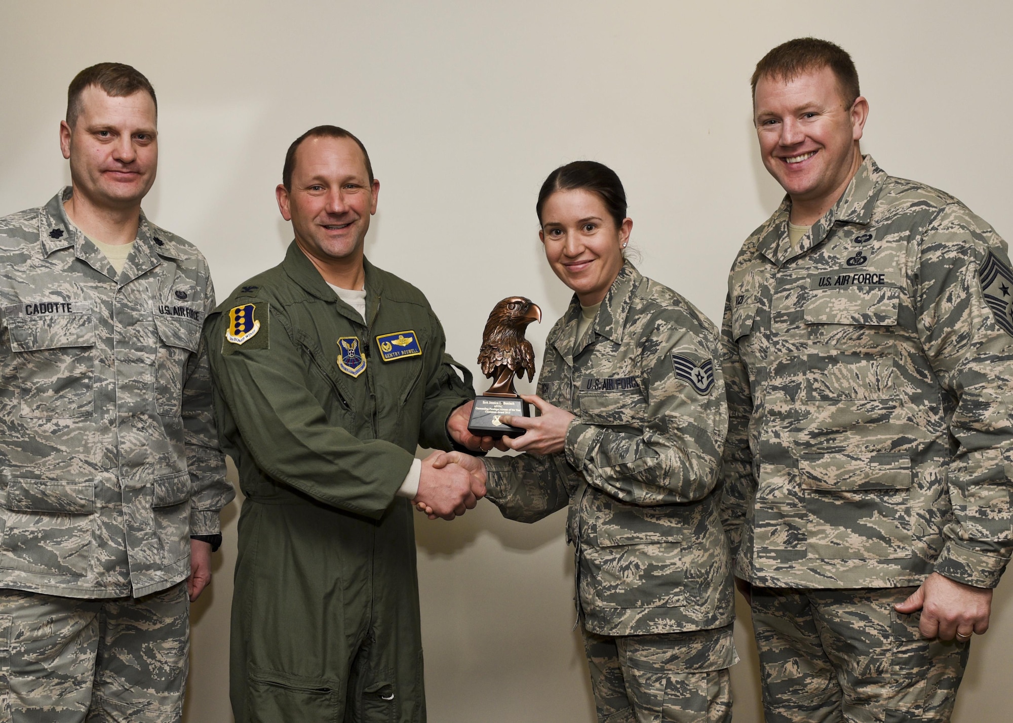 Col. Gentry Boswell, the 28th Bomb Wing commander, presents Staff Sgt. Jessica Benisch, a paralegal assigned to the 28th Bomb Wing Legal Office, with the Castleman Award, on Jan. 12, 2017, at Ellsworth Air Force Base, S.D. The award recognizes her as the most outstanding paralegal in Air Force Global Strike Command for 2015. (U.S. Air Force photo by Airman 1st Class Randahl J. Jenson)