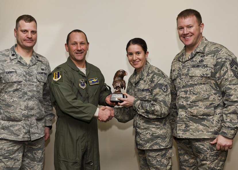 Col. Gentry Boswell, the 28th Bomb Wing commander, presents Staff Sgt. Jessica Benisch, a paralegal assigned to the 28th Bomb Wing Legal Office, with the Castleman Award, on Jan. 12, 2017, at Ellsworth Air Force Base, S.D. The award recognizes her as the most outstanding paralegal in Air Force Global Strike Command for 2015. (U.S. Air Force photo by Airman 1st Class Randahl J. Jenson)