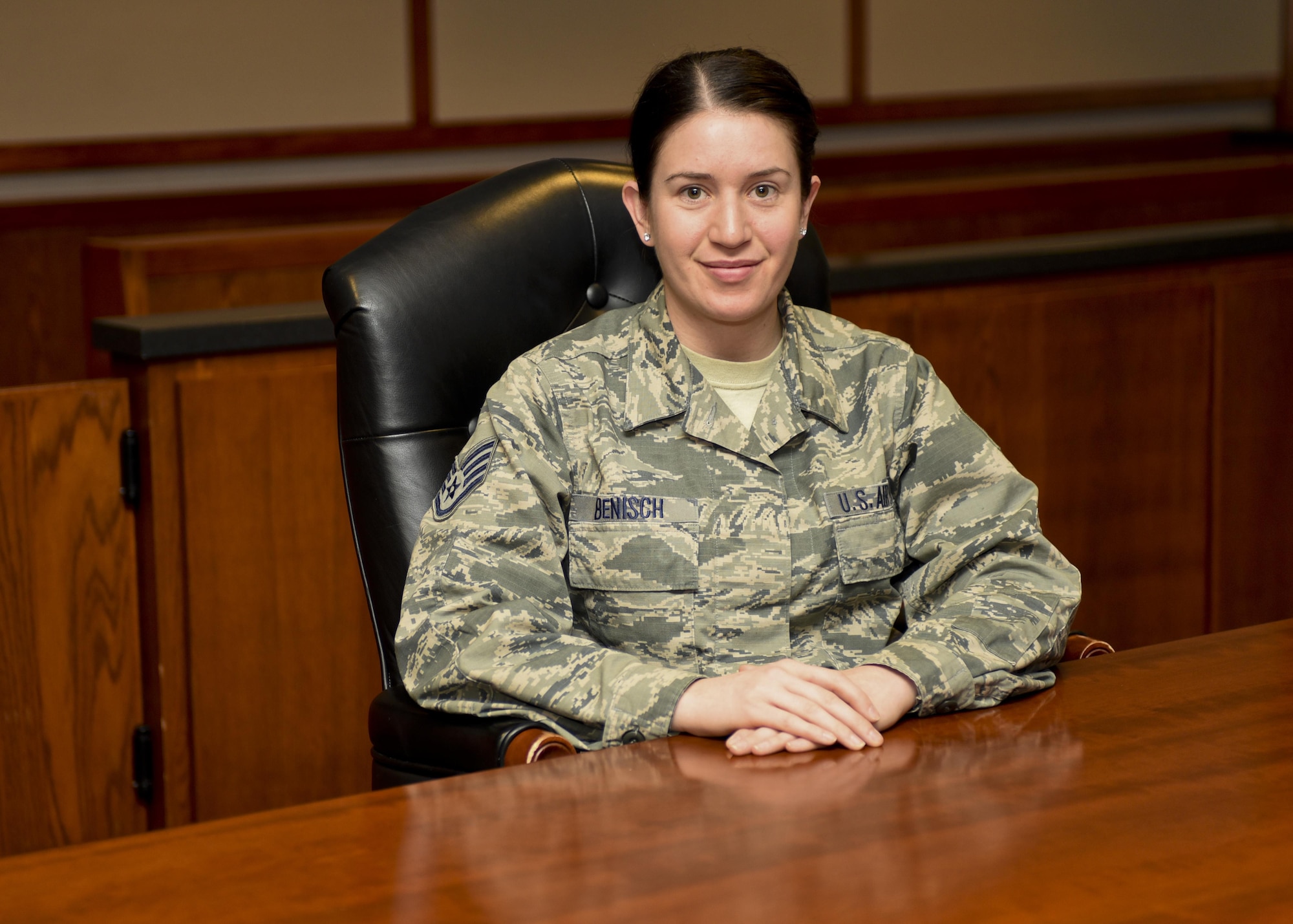 Staff Sgt. Jessica Benisch, a paralegal assigned to the 28th Bomb Wing Legal Office, sits inside the 28th Bomb Wing court room, on Jan. 12, 2017, at Ellsworth Air Force Base, S.D. Benisch was awarded the Castleman Award for 2015, recognizing her as the most outstanding paralegal in Air Force Global Strike Command. (U.S. Air Force photo by Airman 1st Class Randahl J. Jenson)