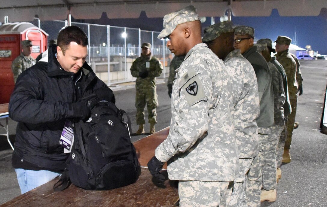 National Guardsmen assist the Transportation Security Administration with checking bags at access points to the National Mall to support the 58th presidential inauguration in Washington, D.C., Jan. 20, 2017. Army National Guard photo by Capt. Jessica Donnelly