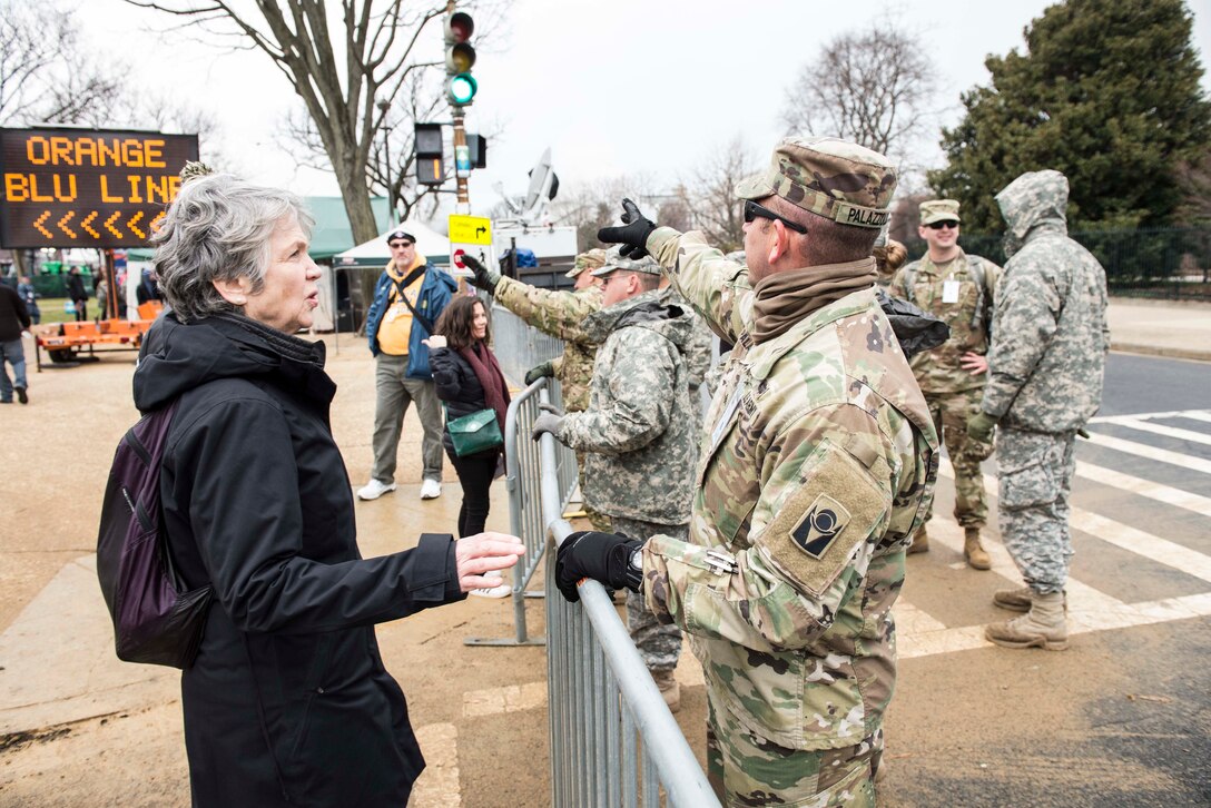 A National Guardsman provides direction to a citizen during 58th presidential inauguration in Washington, D.C., Jan. 20, 2017. The guardsman is assigned to the Florida Army National Guard's 53rd Infantry Brigade Combat Team. Army National Guard photo by Ching Oettel