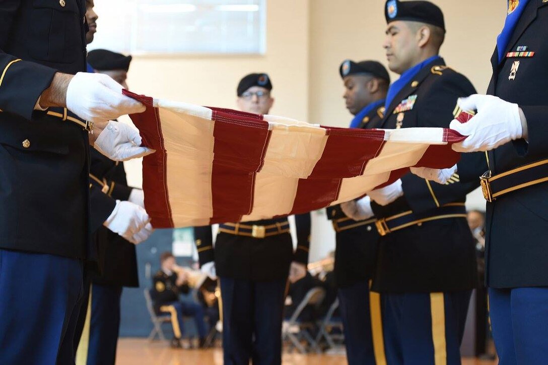 Army Reserve Soldiers assigned to the 85th Support Command headquarters conduct a flag folding during the command's retirement ceremony, Jan. 7, 2017. Three Soldiers, assigned to the command, retired with a combined 82 years of service.
(Photo by Sgt. Aaron Berogan)