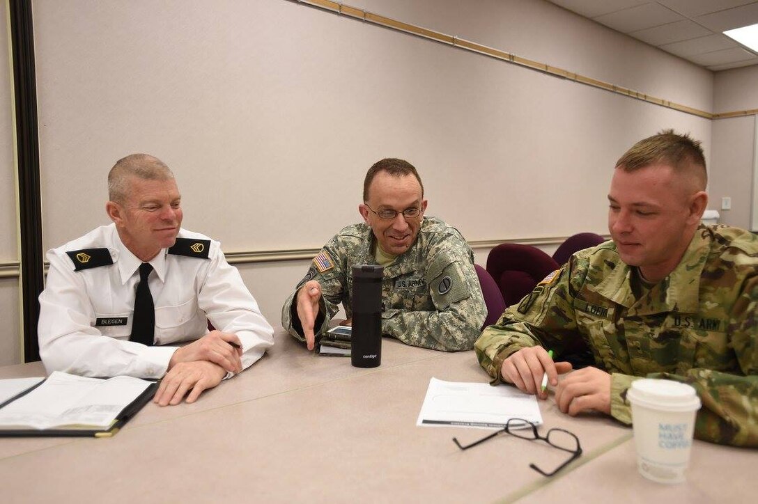 Soldiers assigned to the 85th Support Command headquarters discuss a Problem Solving practical exercise during a Master Resiliency Training class, Jan. 7, 2017.
 MRT is the U.S. Army's Comprehensive Soldier & Family Fitness Resilience training. The training is a key component of the Army's Ready and Resilient campaign plan and designed to further develop the Army's culture of total fitness and increased psychological health.
(Photo by Sgt. Aaron Berogan)

