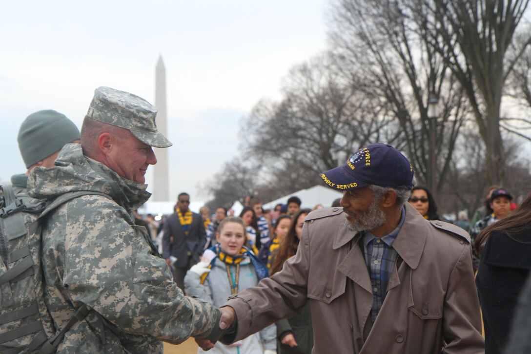 A National Guardsman shakes hands with a veteran before the 58th presidential nauguration in Washington, D.C., Jan. 20, 2017. The guardsman is assigned to the Florida Army National Guard. Army National Guard photo by Sgt. Debra Cook