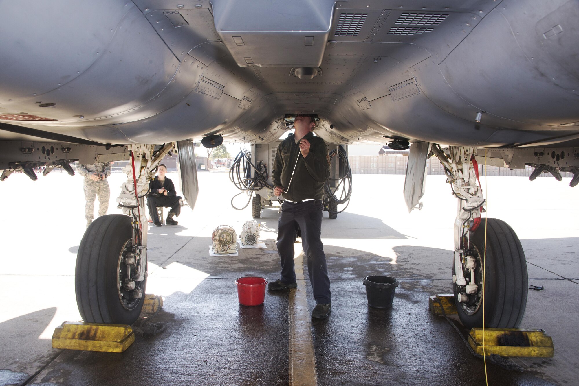 U.S. Air Force Staff Sgt. Mark Siefner, a crew chief with the 334th Aircraft Maintenance Unit, out of Seymour Johnson Air Force Base, N.C., repairs an F-15E Strike Eagle at Davis-Monthan AFB, Ariz., Jan. 18, 2017. New pilots from the 334th Fighter Squadron participated in a two week training course with the F-15E throughout southern Arizona's military operating areas. (U.S. Air Force photo by Airman 1st Class Giovanni Sims)