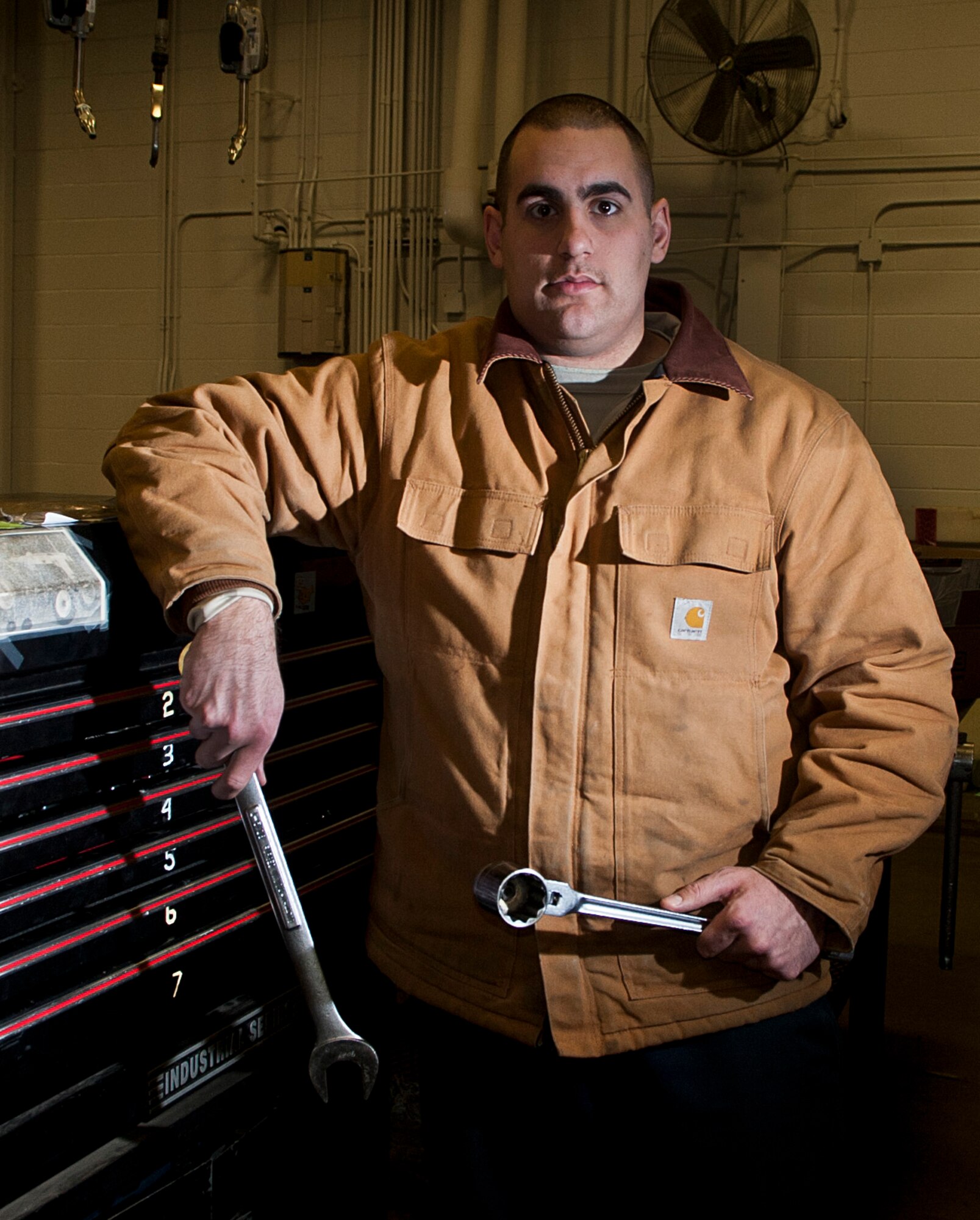 Senior Airman Kevin Sylvia, 5th Logistics Readiness Squadron vehicle maintenance technician, holds maintenance tools at Minot Air Force Base, N.D., Jan. 4, 2017. The 5 LRS special purpose maintainers are trained to perform inspections, repairs and rebuild vehicle components and assemblies. (U.S. Air Force photo/Airman 1st Class Jonathan McElderry)