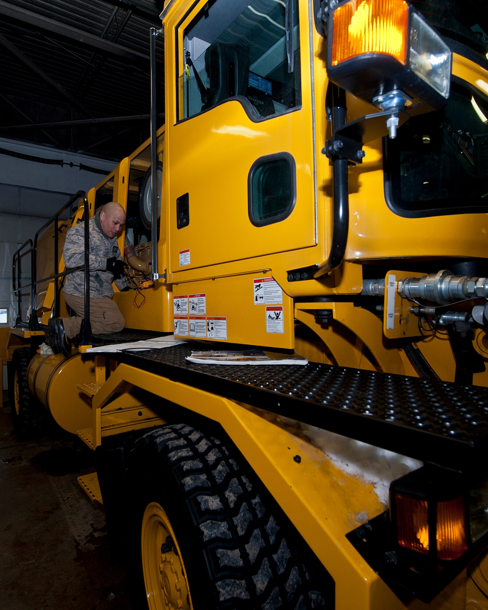 Staff Sgt. Jason Montano, 5th Logistics Readiness Squadron vehicle maintenance technician, troubleshoots a snow blower vehicle at Minot Air Force Base, N.D., Jan. 4, 2017. The 5 LRS special purpose shop maintainers work on various components of government vehicles, such as electrical systems, brakes, transmissions, and heating and cooling systems. (U.S. Air Force photo/Airman 1st Class Jonathan McElderry)