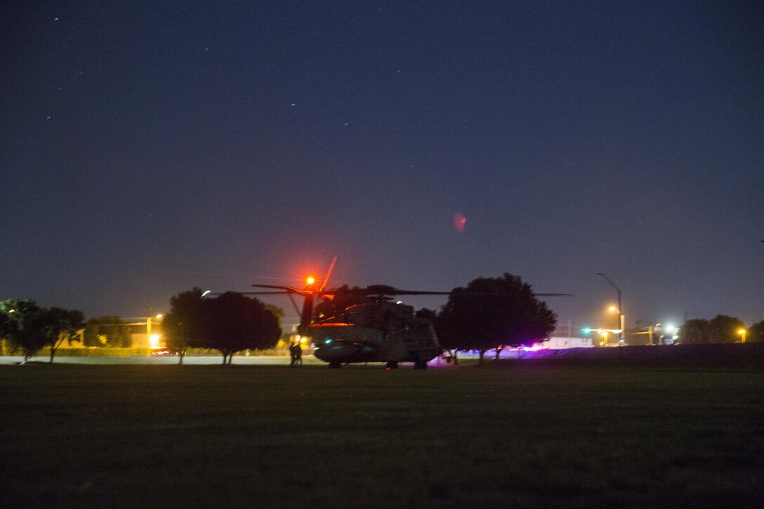 ACH-53E helicopter, with Marine Aviation Weapons and Tactics Squadron One offloads personnel and supplies to render aid and provide disaster relief to displaced civilians, role-players, at Kiwanis Park in Yuma, Ariz. during a Humanitarian Assistance/Disaster Relief (HA/DR) Exercise, part of the Weapons and Tactics Instructor Course 1-17, Friday, October 14, 2016. The training exercise enabled ground, aviation and support Marines and sailors to work as a team to practice deploying medical personnel, supplies, and extract personnel and people displaced from their communities. 
