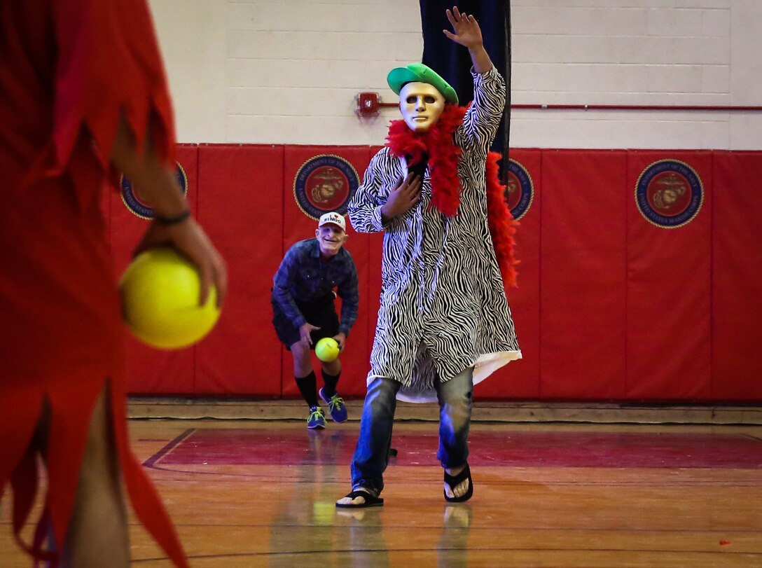 Marines engage in a round of dodge-ball as part of the “Dodge of the Dead” Halloween-themed tournament hosted by the Single Marine Program at the gym aboard Marine Corps Air Station Yuma, Ariz., Tuesday, October 18, 2016.