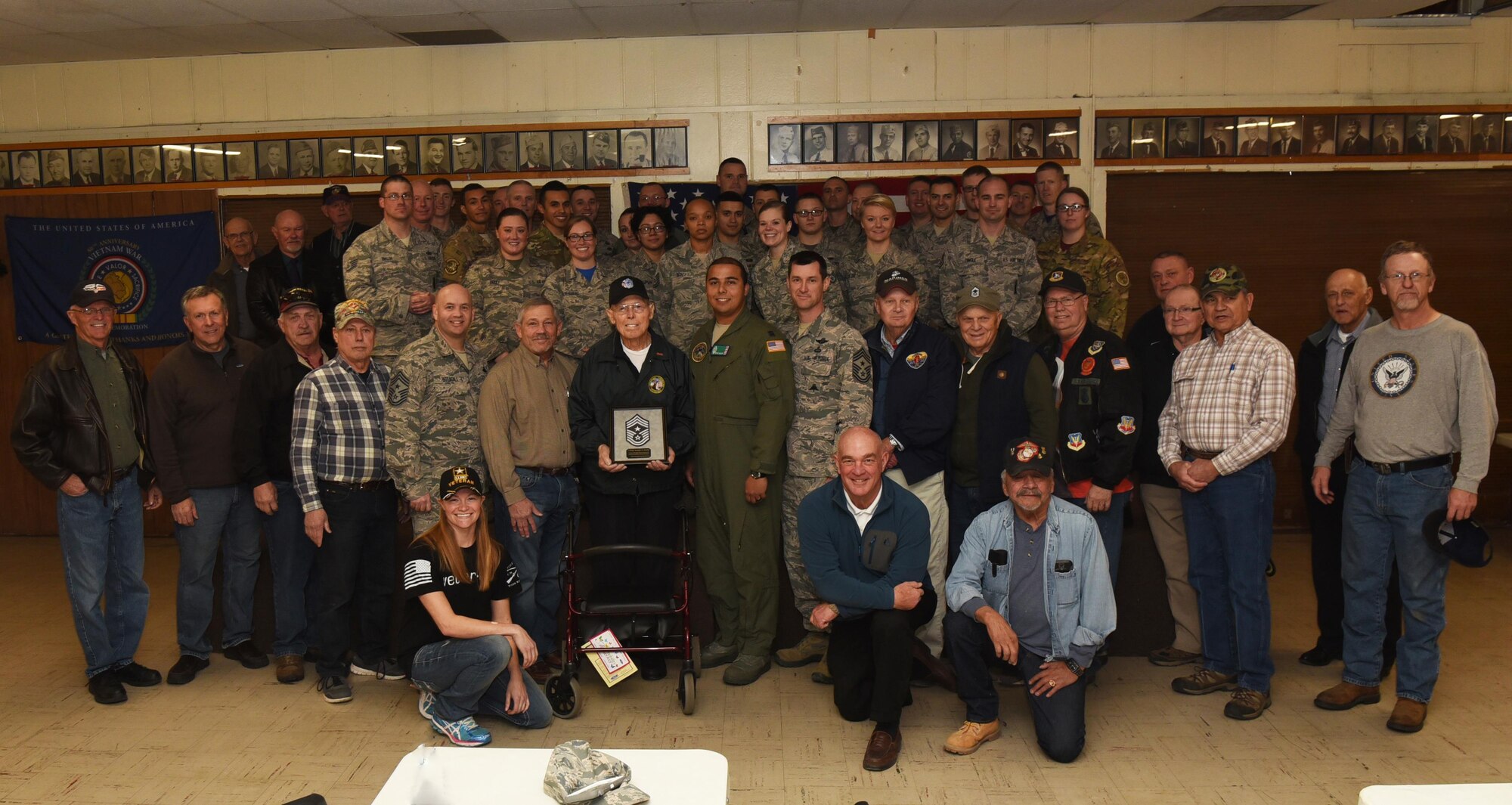 F.E. Warren Airmen pose with Joe Gordy, retired chief master sergeant, at the VFW in Greeley, Colo., Jan. 13, 2017. Chief Master Sgt. Jeffrey Steagall, 90th Missile Wing command chief, rallied approximately 40 Airmen to visit Gordy in order to show appreciation for his service. (U.S. Air Force photo by Airman 1st Class Breanna Carter)