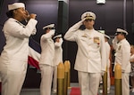 JOINT BASE PEARL HARBOR-HICKAM, Hawaii (January 20, 2017) Cmdr. Gary Montalvo is piped ashore during the Virginia-class fast-attack submarine USS North Carolina (SSN 777) change of command at Sharkey Theater in Joint Base Pearl Harbor-Hickam. Montalvo was relieved by Cmdr. Matthew Lewis. (U.S. Navy Photo by Mass Communication Specialist 2nd Class Michael H. Lee)