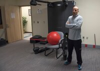 Will Saultes, 92nd Aerospace Medical Squadron Health Promotion Office coordinator, stands in front of a low-impact strength training machine Jan. 17, 2016, Fairchild Air Force Base, Wash. The HPO offers Return to Duty clinics for Airmen to regain strength as part of the injury recovery process.