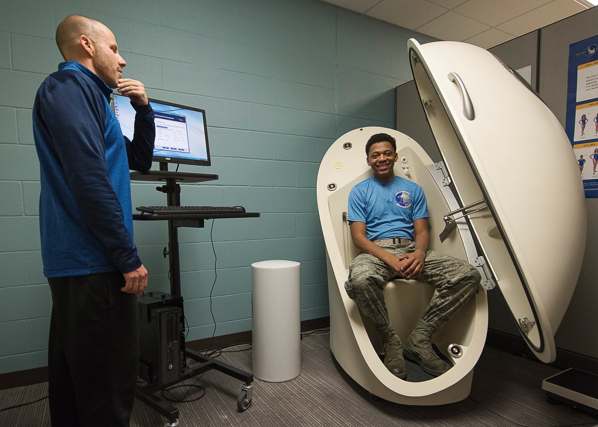 Will Saultes, 92nd Aerospace Medical Squadron Health Promotion Office coordinator,  works to calculate the body fat percentage of Senior Airman Stone Williams, 92nd Force Support Squadron journeyman, at the Health Promotion Office Jan. 20, 2016, Fairchild Air Force Base, Wash. The Bod Pod uses air displacement to accurately determine body fat percentages. 