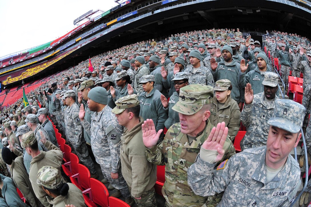 National Guard soldiers and airmen swear in as District of Columbia special police at FedEx Field in Landover, Md., Jan. 19, 2017. The guardsmen are here in preparation of the 58th Presidential Inauguration providing several critical functions including crowd management, traffic control, emergency services, logistics, and ceremonial marching elements. Army National Guard photo by 2nd Lt. Brendan Mackie 