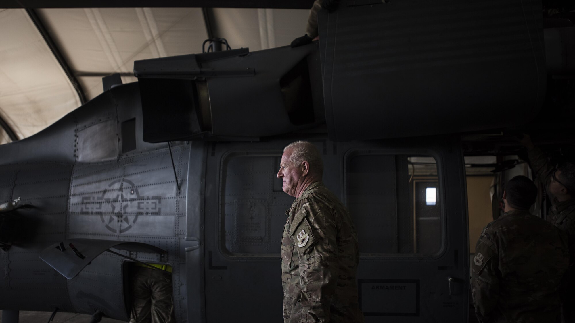 Master Sgt. James Dullaghan, 455th Expeditionary Aircraft Maintenance Squadron Helicopter Maintenance Unit HH-60 Pave Hawk dedicated crew chief, walks past his aircraft during a 50-hour inspection Jan. 19, 2017 at Bagram Airfield Afghanistan. Dullaghan first enlisted in the Air Force in 1978 and returned in 2009 after a twenty-year break in service. (U.S. Air Force photo by Staff Sgt. Katherine Spessa)