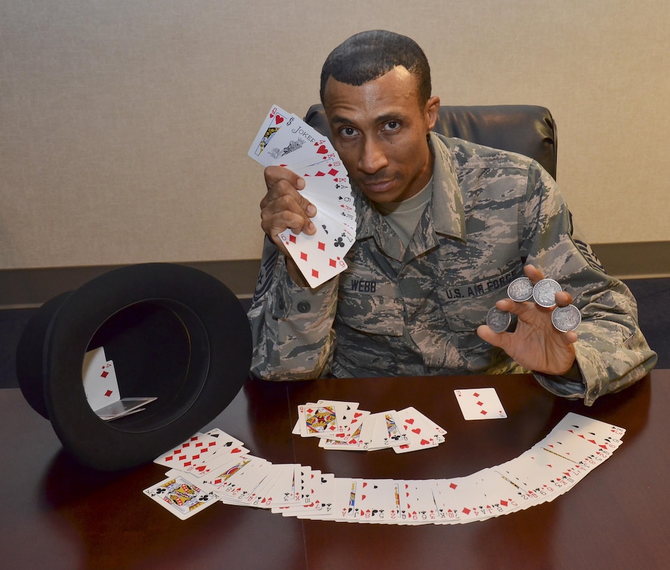 Master Sgt. Micheal Webb displays cards used in magic tricks at the 117 Air Refueling Wing, Birmingham, Ala., Oct. 15, 2016.  (U.S. Air National Guard photo by Staff Sgt. Jeremy Farson)