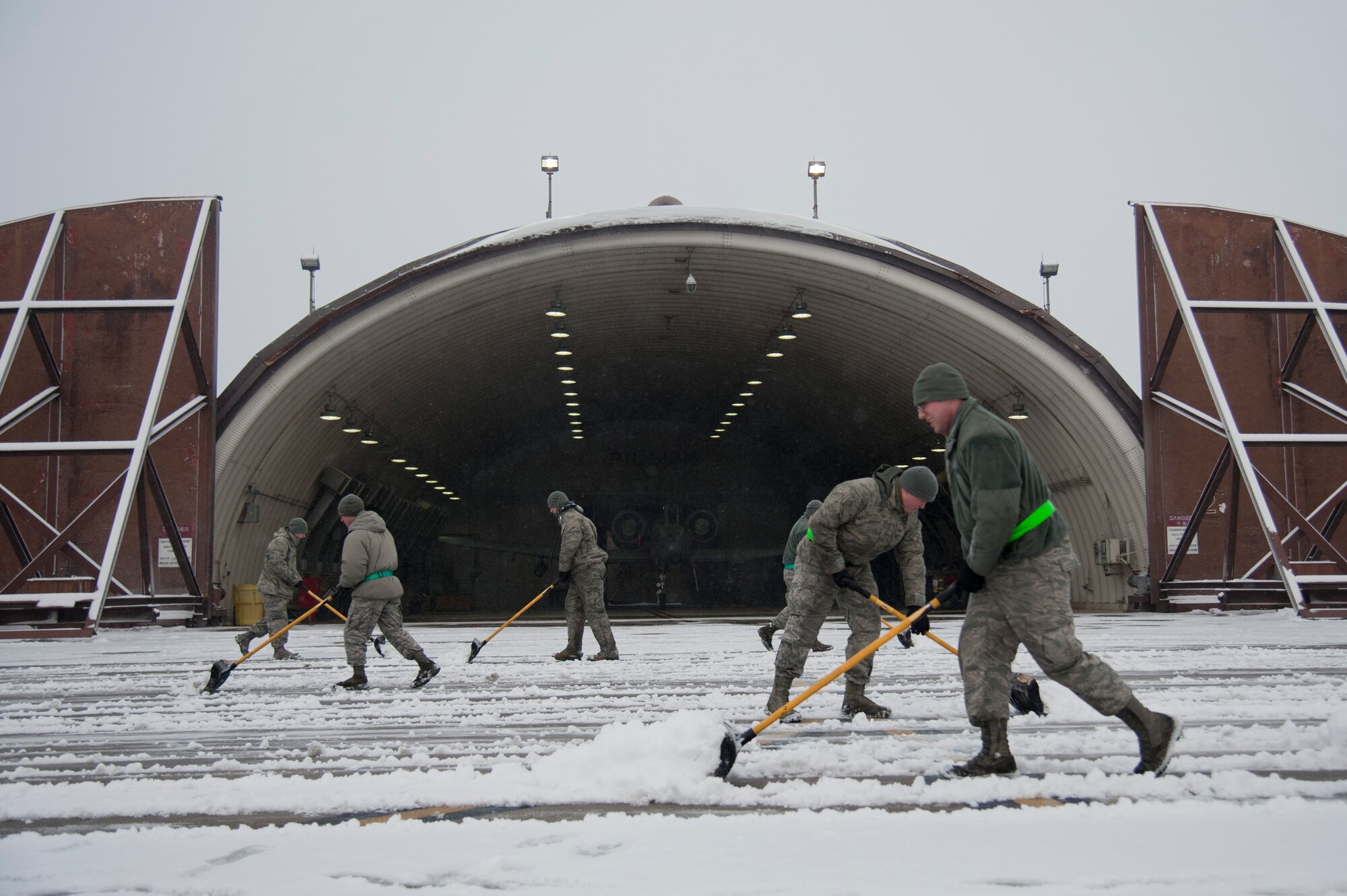 U.S. Air Force aircraft maintainers from the 25th Aircraft Maintenance Unit shovel snow in front of an A-10 Thunderbolt II hangar on Osan Air Base, Republic of Korea, Jan. 20, 2016. The 25th AMU maintainers ensure that are A-10s are combat ready no matter what the weather brings. (U.S. Air Force photo by Staff Sgt. Jonathan Steffen)